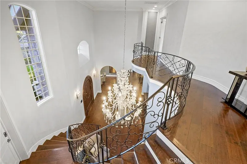 Wrought-iron balustrade over the entry at One Zoom Listing