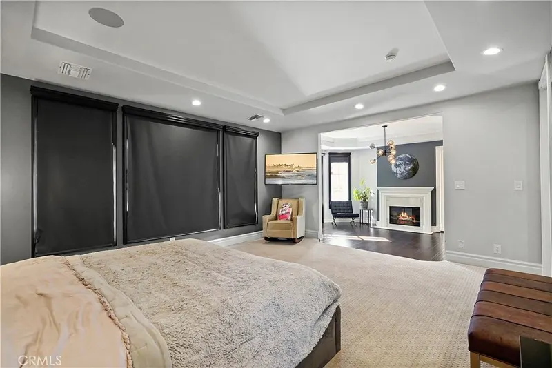 Primary suite with fireplace and sitting area at One Zoom Listing