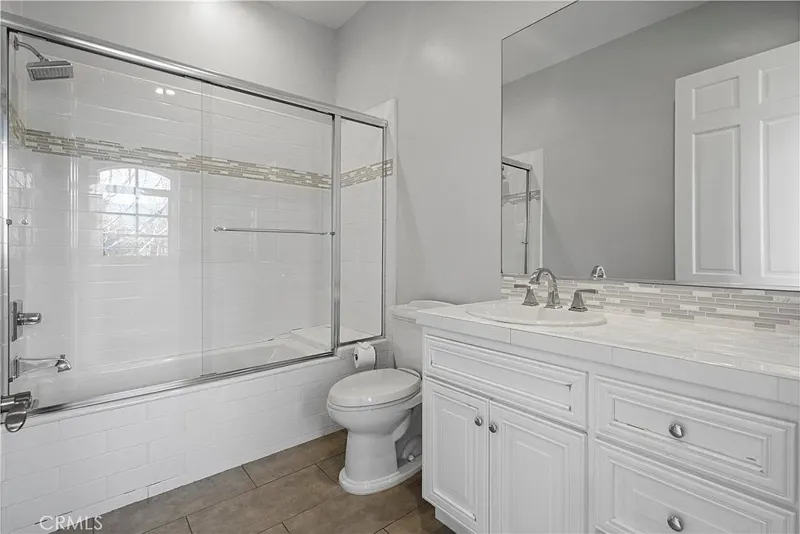 Guest bath with marble vanity at One Zoom Listing