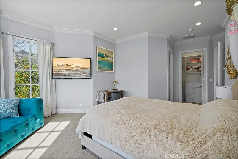 Bedroom suite with walk-in closet at One Zoom Listing