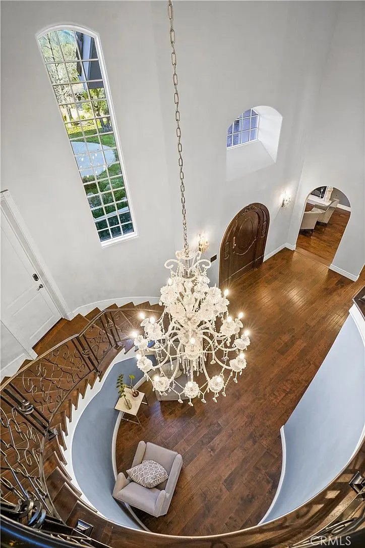Foyer chandelier viewed from above at One Zoom Listing